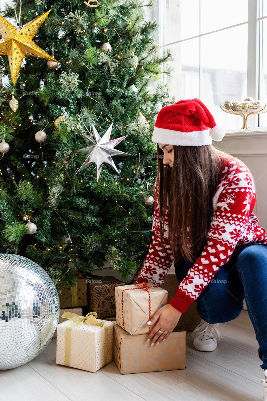 woman holding christmas gifts