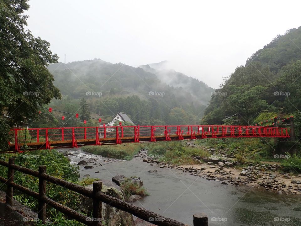 Red bridge in the fog