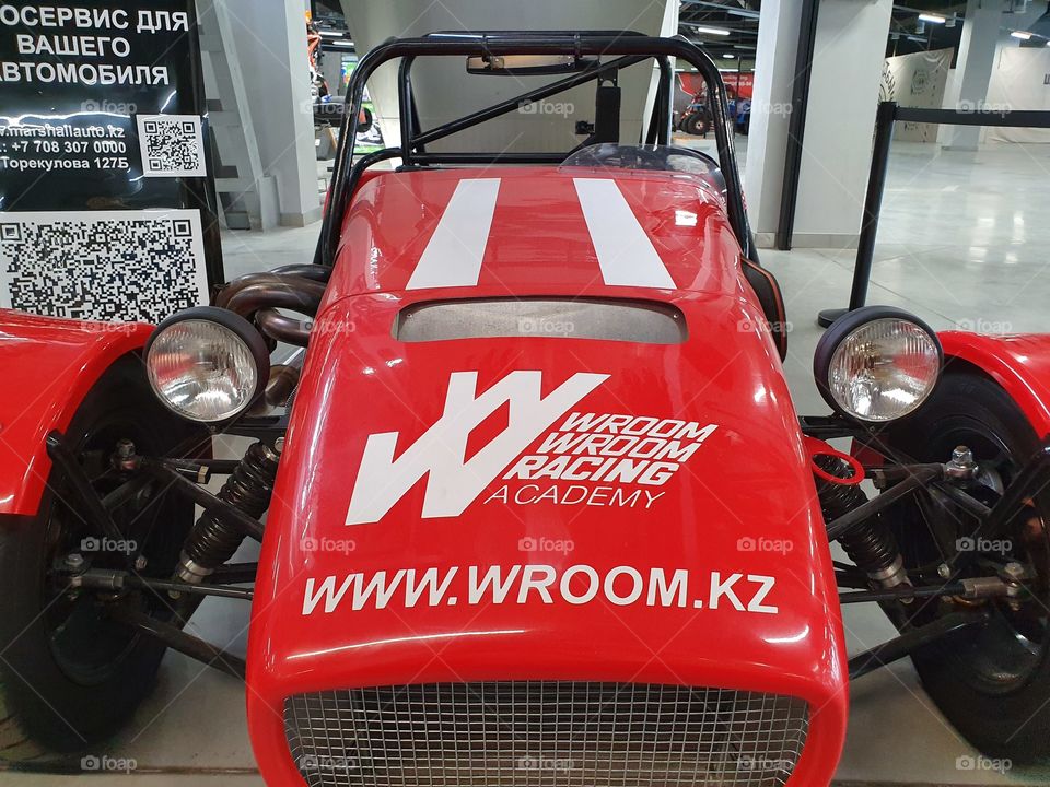 bright red racing car in exhibition