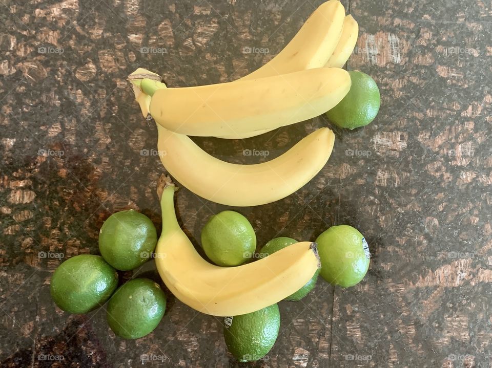 Fruit for breakfast bananas and limes 