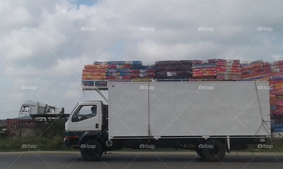 transporting  mattresses  through  truck