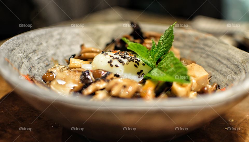 Egg cooked at low temperature with mushrooms and mint