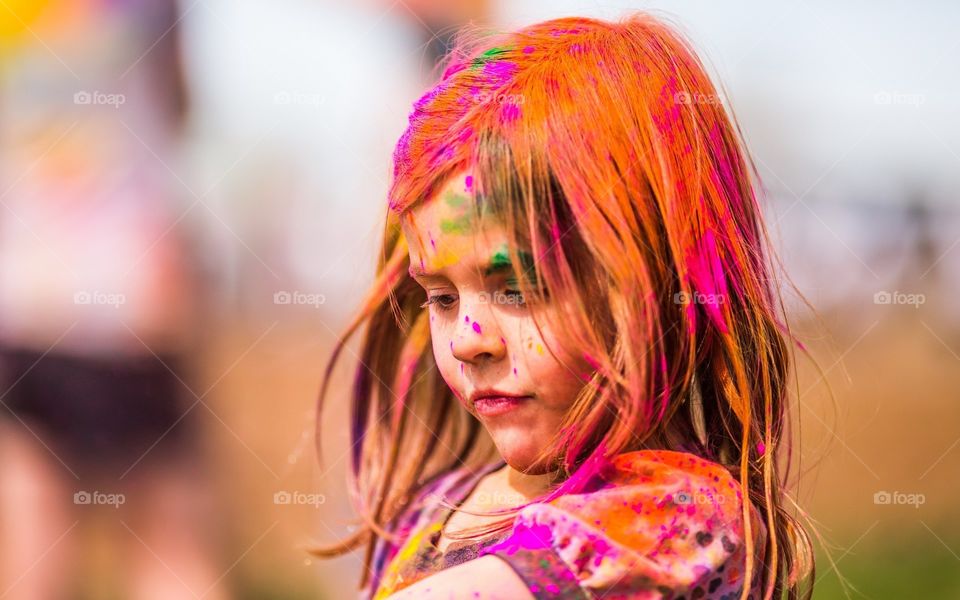 she is cutest young girl and she is busy in holi which is most valuable festival of India
we also know it festival of colour
because every indian people enjoy this festival and celebrate with colour