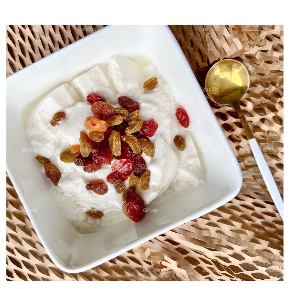 Superfood almond yogurt with raisins and cranberries