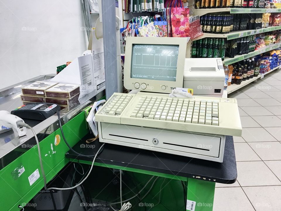 Supermarket counter desk with old fashion computer