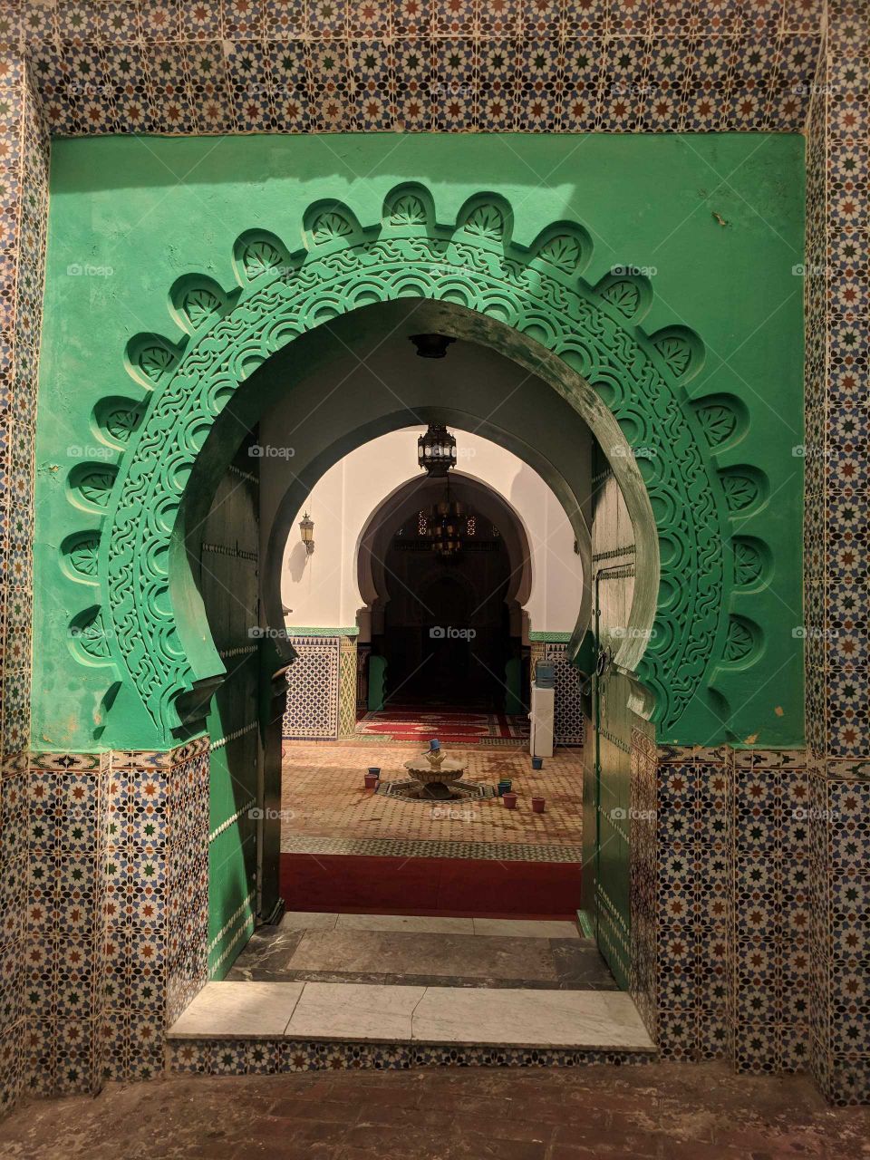 Beautiful Green Arch and Ceramic Mosaic Overlooking a Courtyard in Tangier, Morocco