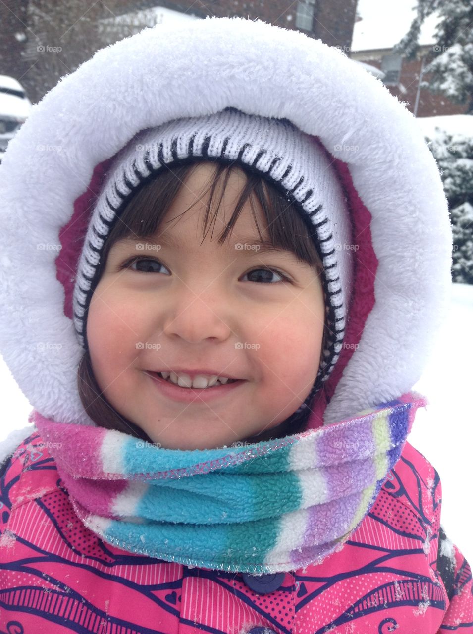 Happy girl wearing warm clothing in winter