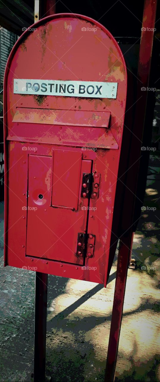 bright red post box