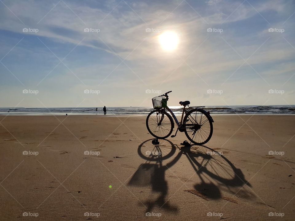 Riding bicycle to the beach