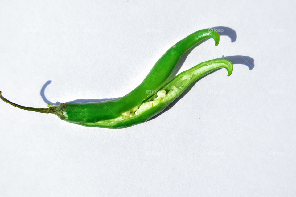 green chilli with its seeds inside