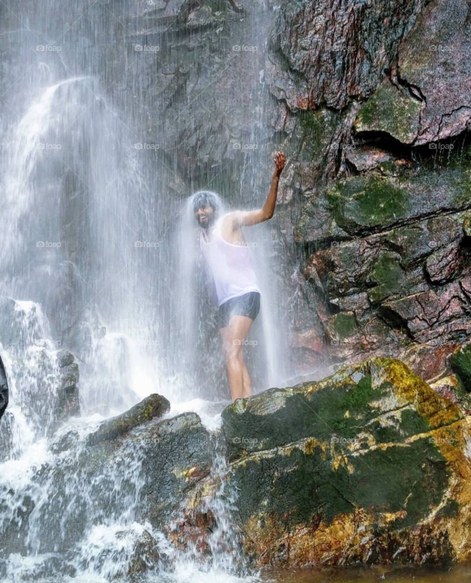 Bath under waterfall