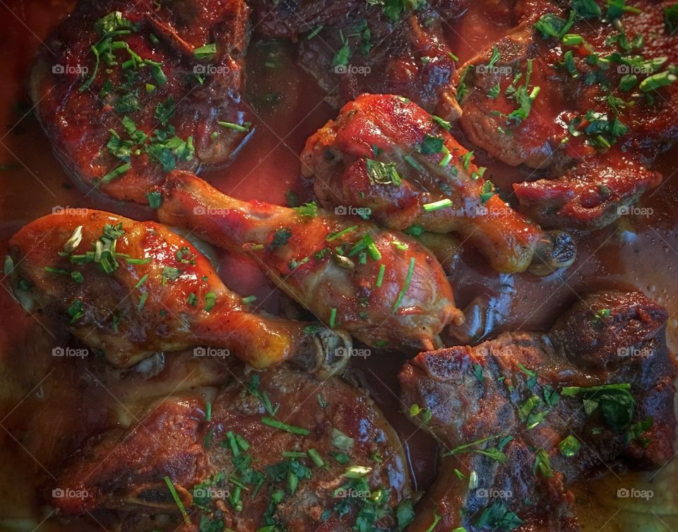 Chicken pieces in red sauce