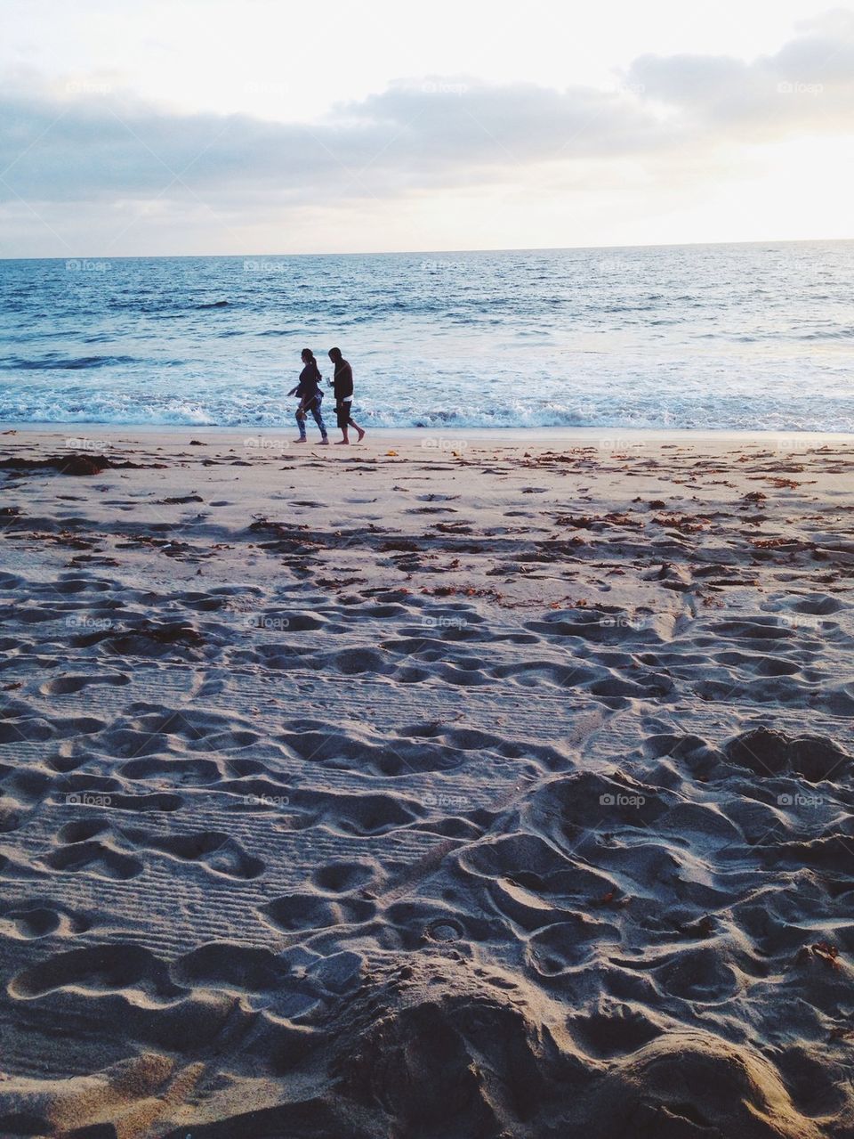 Couple walking on beach