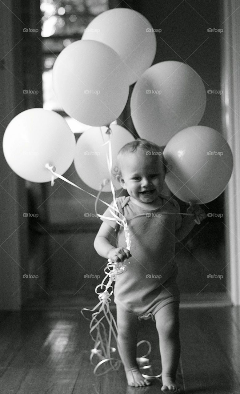 balloon time. baby with birthday balloons 