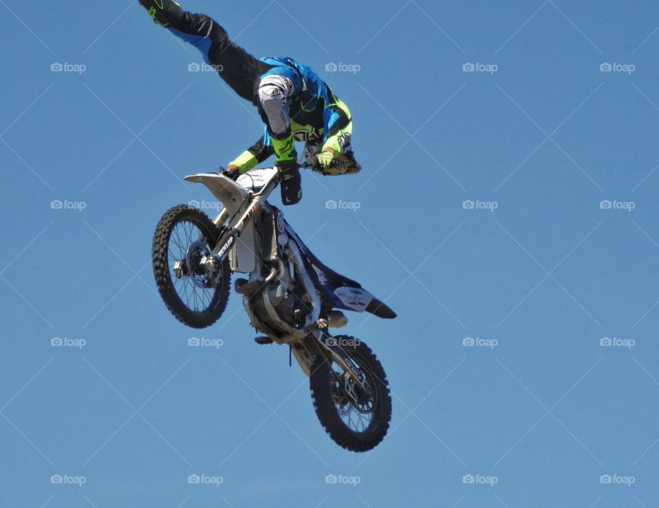 Amazing Motorcycle Stunt. Daredevil Motorcycle Rider Performing Aerial Stunt
