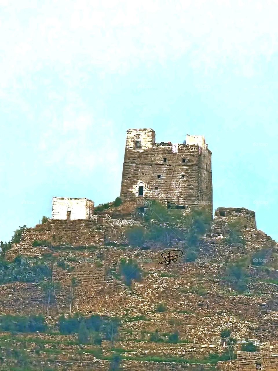 A stunning view of green mountains covered in fog in Yemen