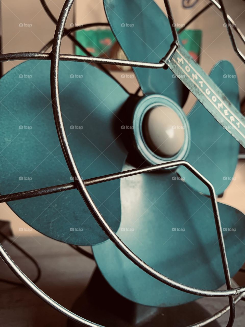 A vintage metal desktop fan, from Montgomery Ward. Practical, pleasing, sturdy, old school.