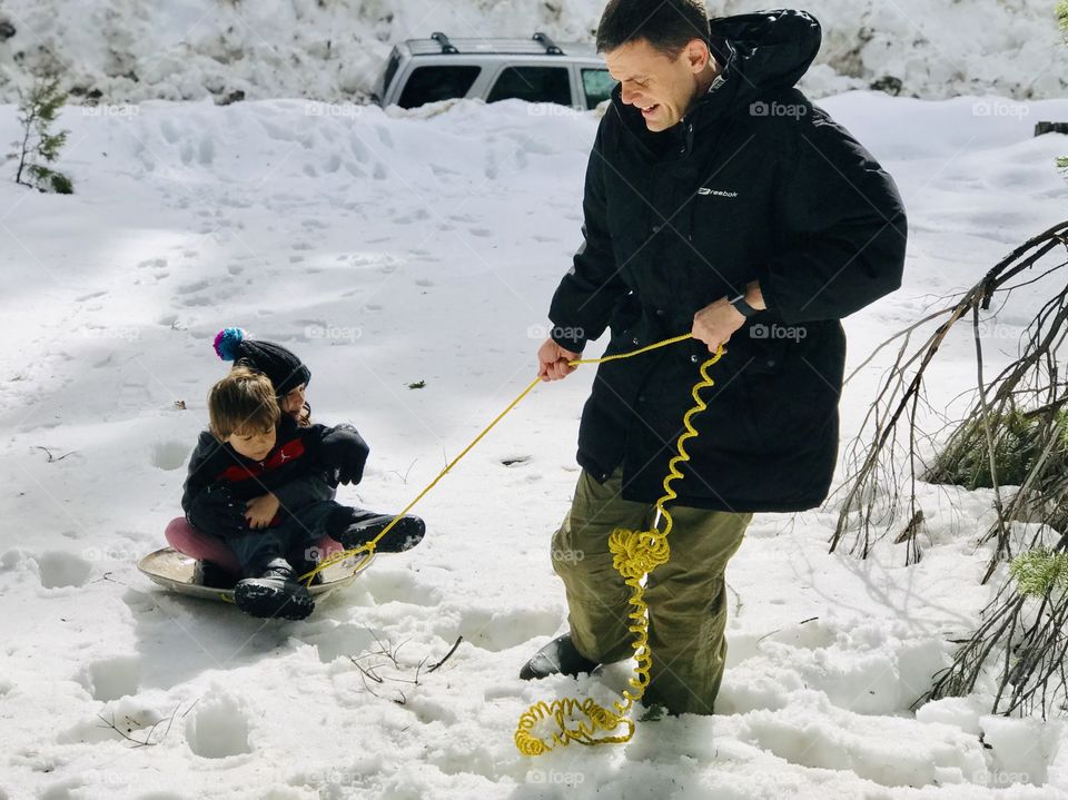 Daddy with his babies on the snow fun day 