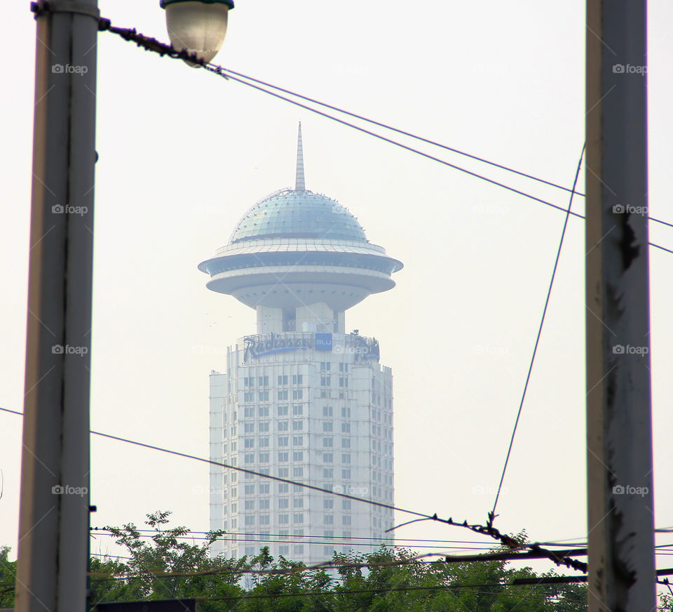 Framed radisson blu hotel. framed the radisson blu hotel in shanghai china between some electric wires.