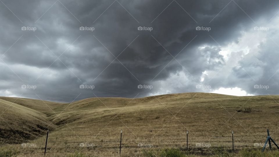 storms over golden hills of CA