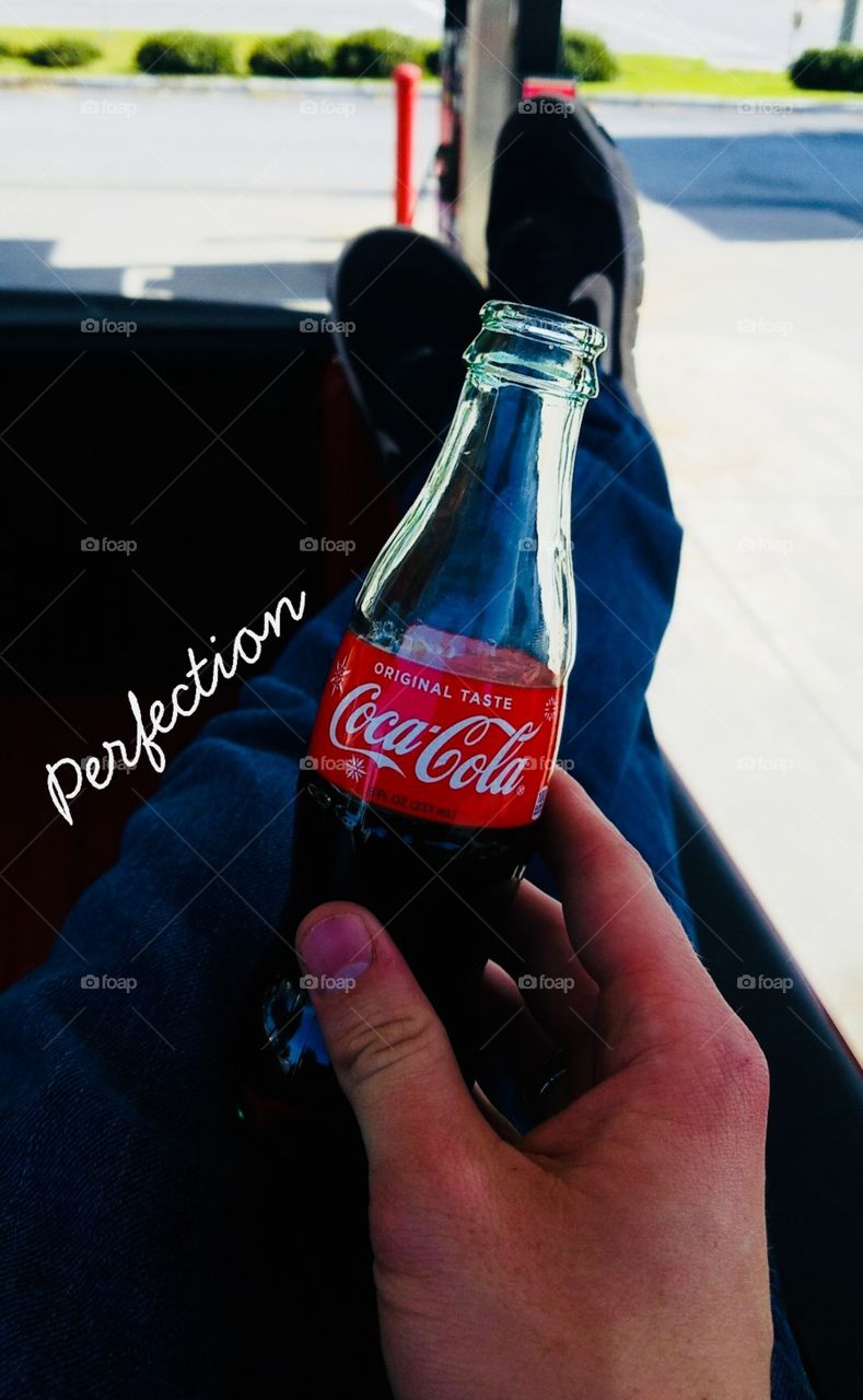 My son enjoying a CocaCola and a smile...perfection!