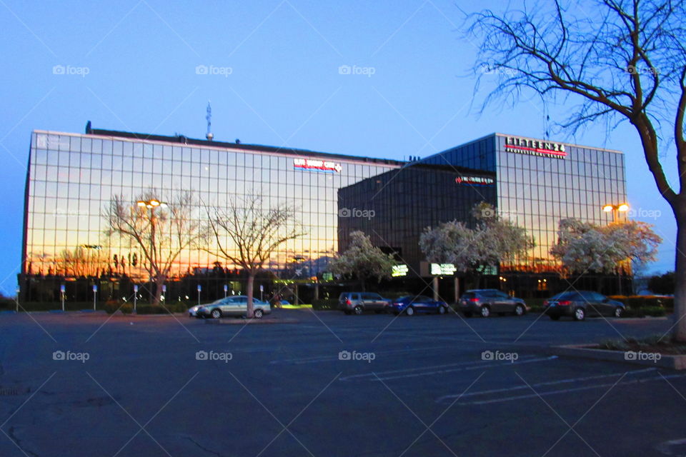 sunset reflection on office building