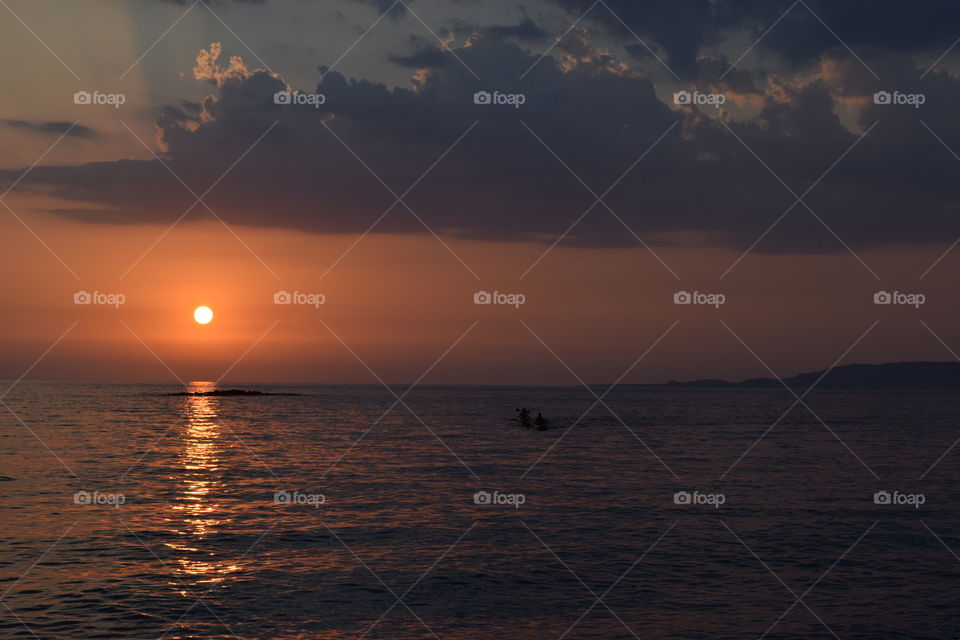 Greece summer sunset canoeing. Greece summer sunset canoeing