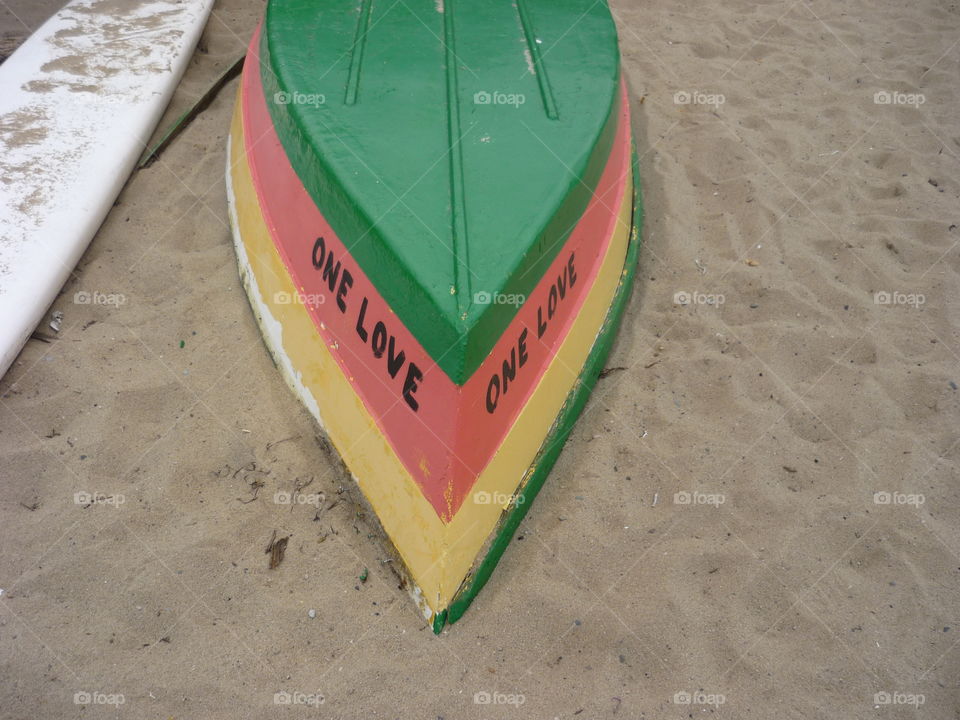 A boat on the beach, one love