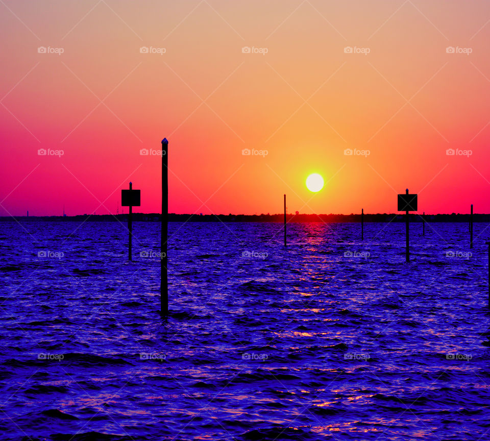Looking towards the horizon I see the fiery golden orb slowly dip into the bay as though engulfed by it! Crimson, amber, pink, and tangerine embracing the heavens gracefully! I am mesmerized as it fades away and wait for another sunset day! Enjoy!