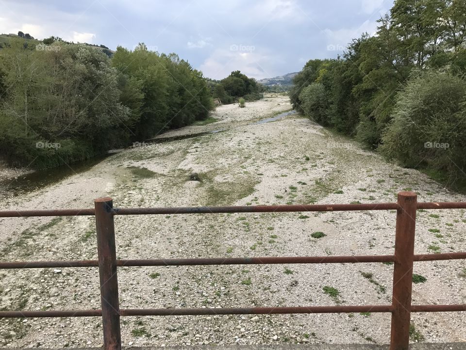 Tesino river dry, view  from the bridge, Marche region, Italy