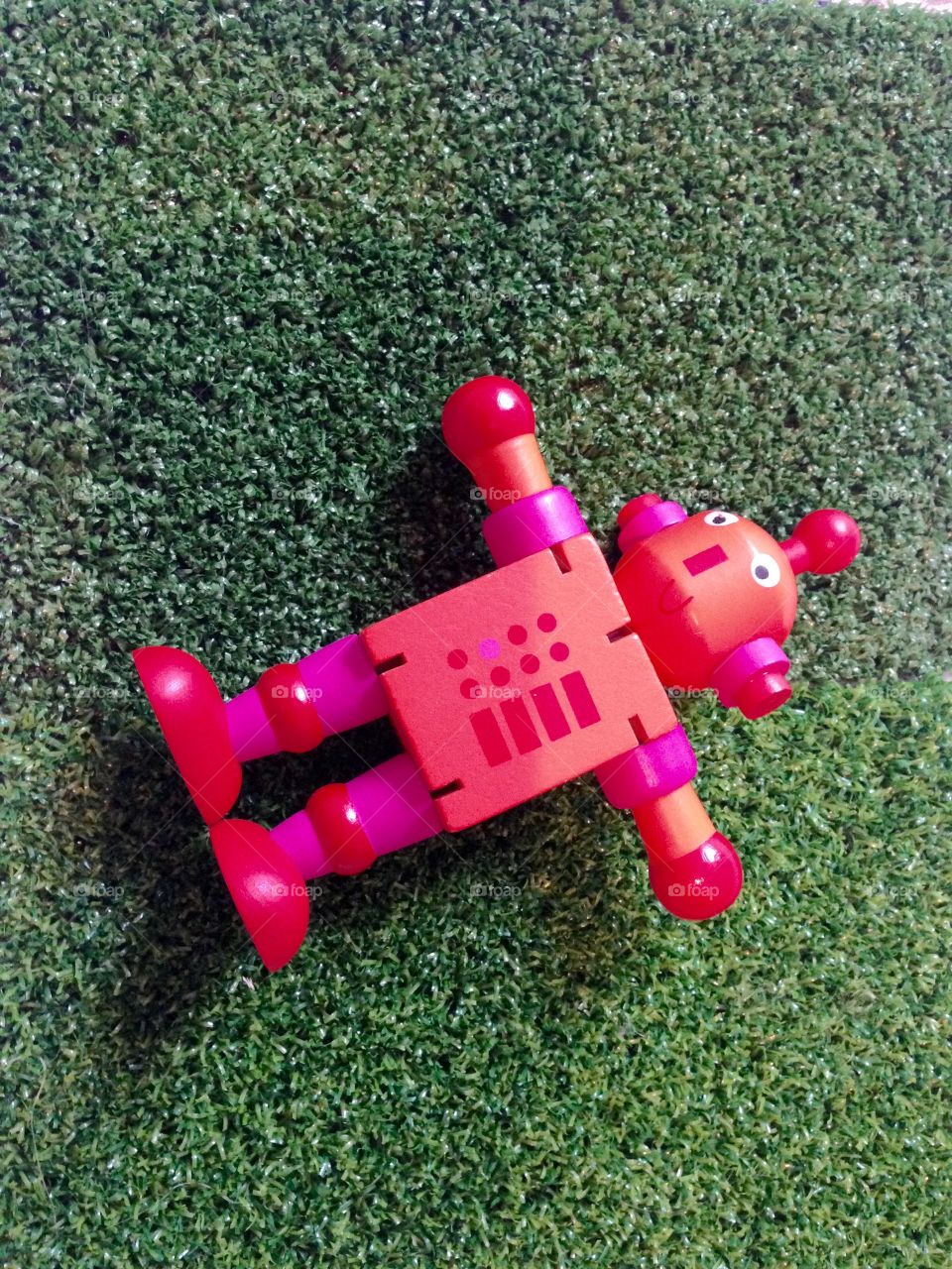 Toy robot left behind in garden 