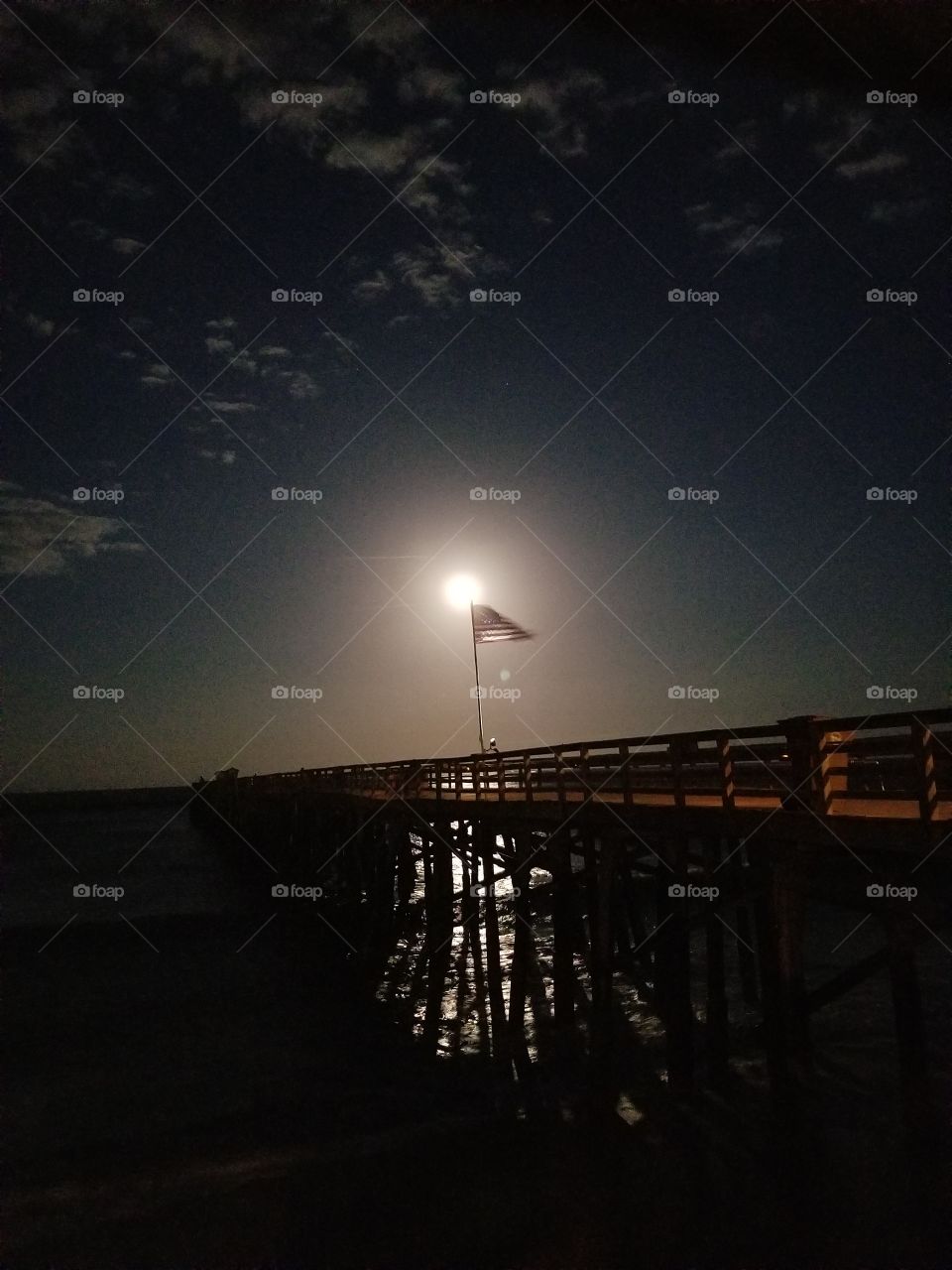 full moon over the pier