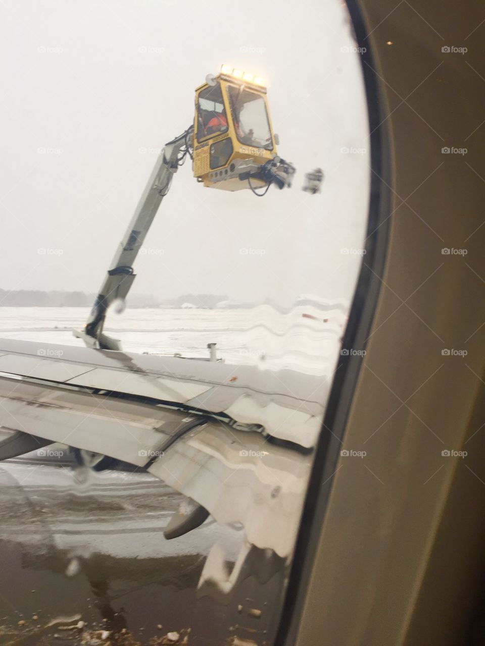 De-icer spray on plane 