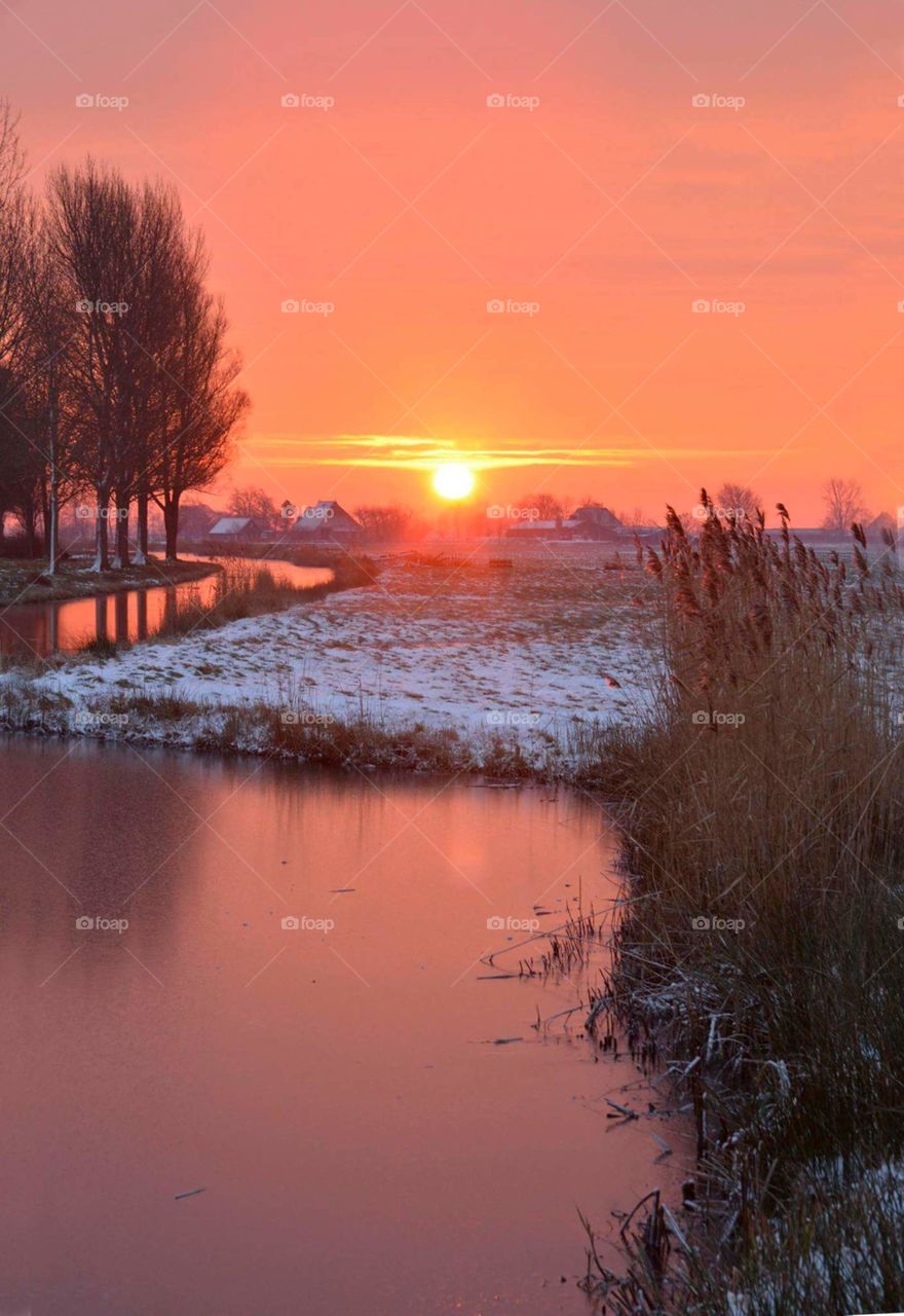 winter landscape with orange  sunset