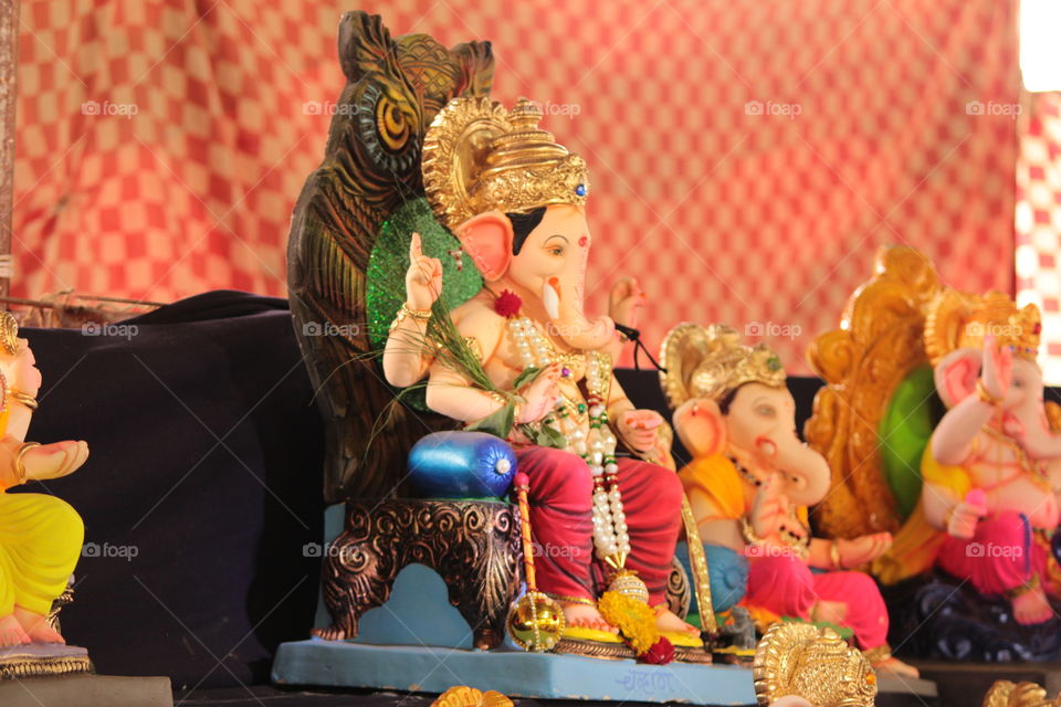 The statue of Lord Ganesha is so beautifully coloured that it pleases the viewers eyes. The statues are made available to sale with different form of statues and with different colour combination on Ganesha Festival in India.