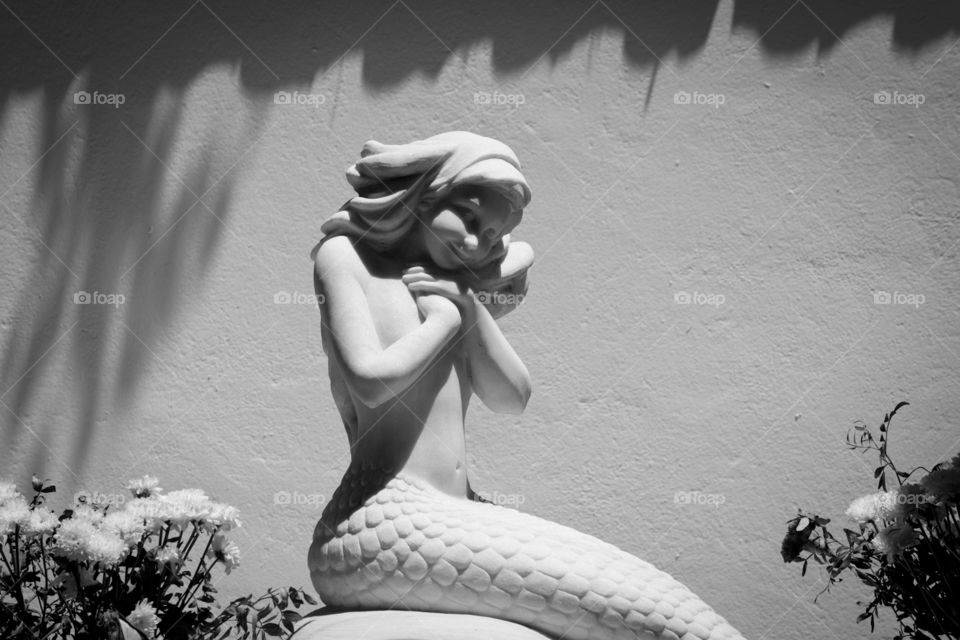 mermaid statue black and white