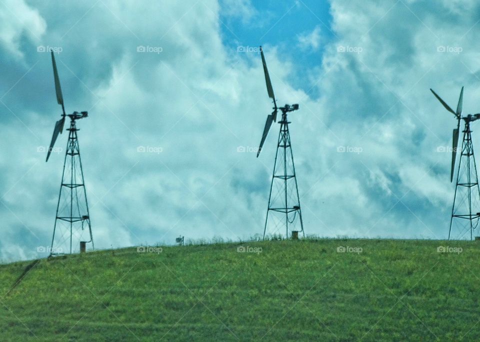 Green Energy Wind Turbines. Row Of Wind Turbines Generating Clean Renewable Energy
