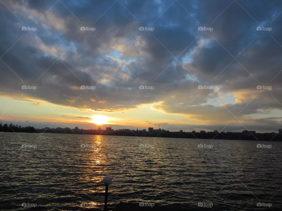 cloudy sky in November, sunset over the city, Voronezh, Russia, river, park