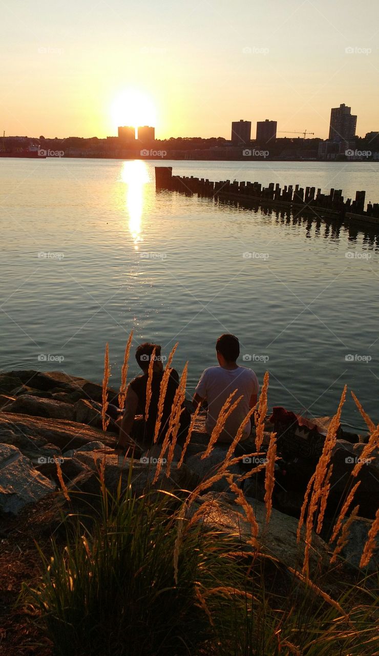 Two people looking at sunset