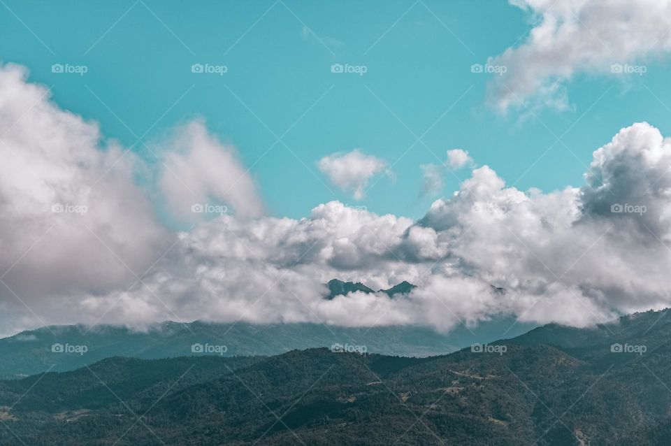 Clouds over the mountains and beautiful bright sky
