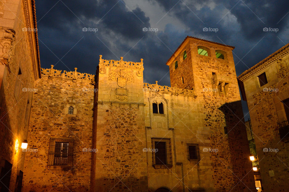 Night view of Palace of Golfines de Abajo in Cáceres, Extremadura, Spain.