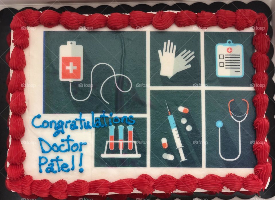 Celebrating becoming a doctor, celebrating residency, celebrating with cake, congratulations doctors, congratulating hard work 