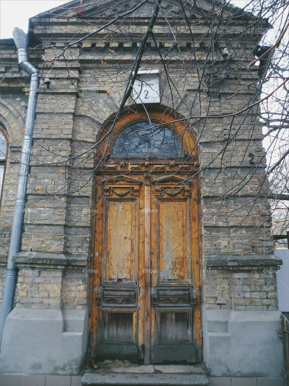 old wooden door in a brick house