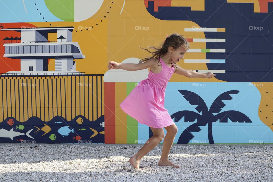 Girl with pink dress dancing