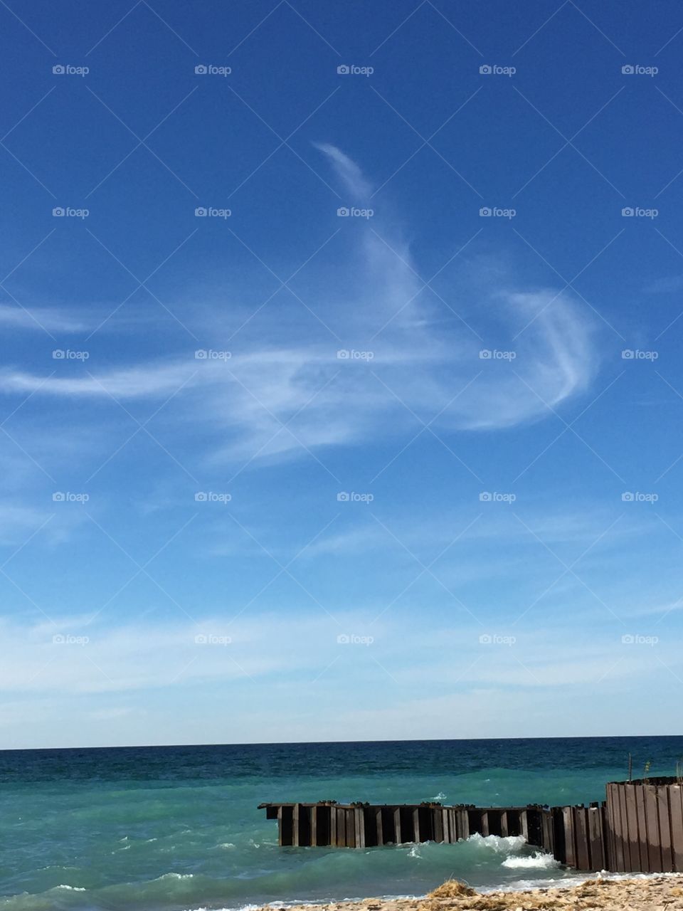 Do you see a penguin?. Clouds above Lake Michigan