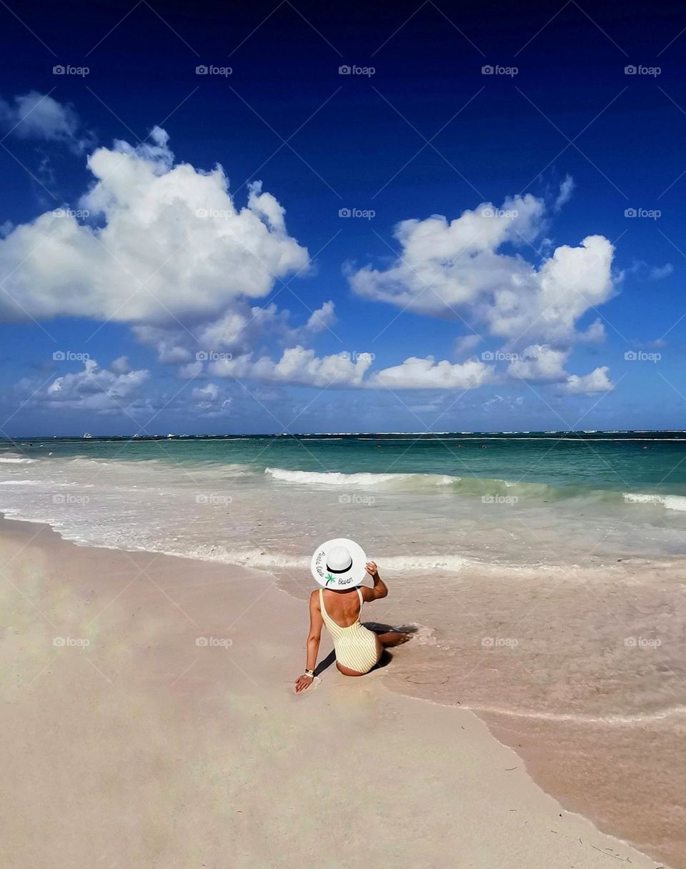 Love Summer. Seashore. Beautiful beach, amazing sunny weather. Woman on the beach...