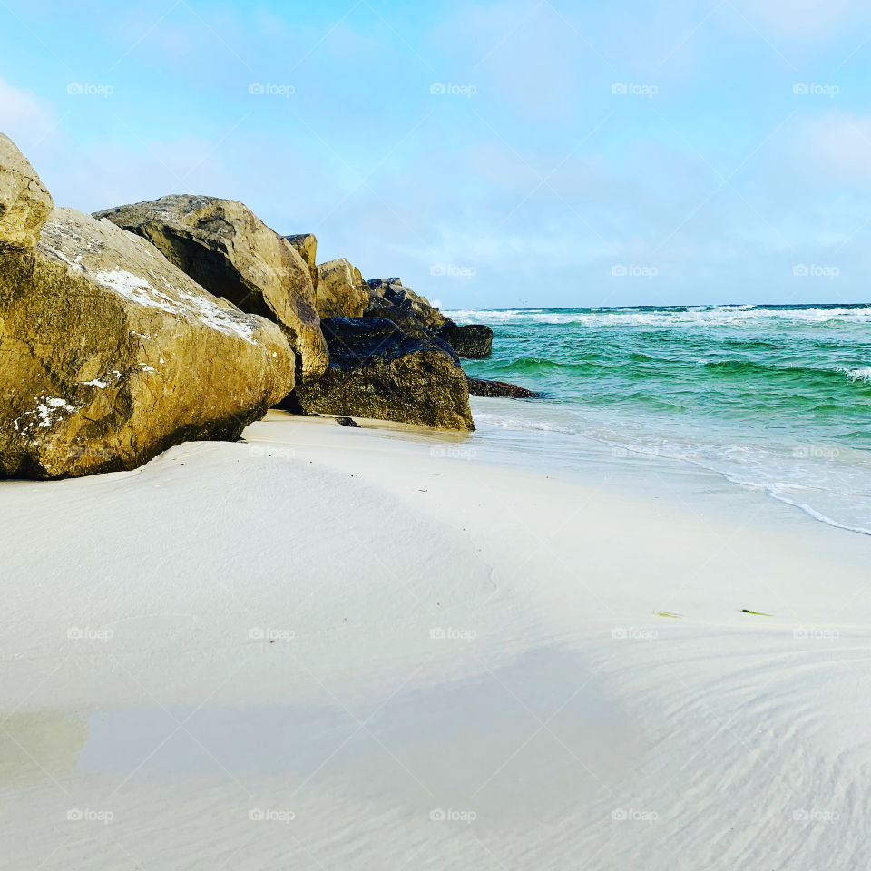 Emerald coast jetties Destin Florida water beach ocean sand rocks waves