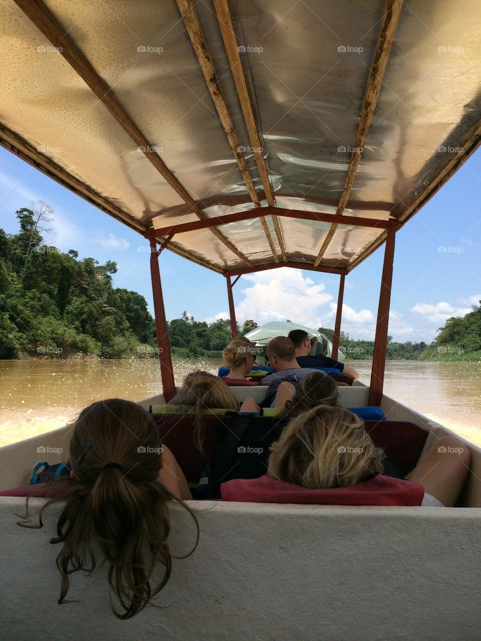 Boat ride on the way to a pit stop village in Taman Negara National park, Malaysia. 
