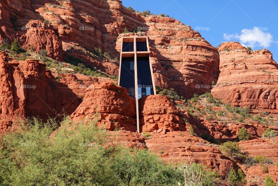 The beautiful Chapel of the Holy Cross in stunning Sedona Arizona is built into the red rocks and is a world famous tourist destination