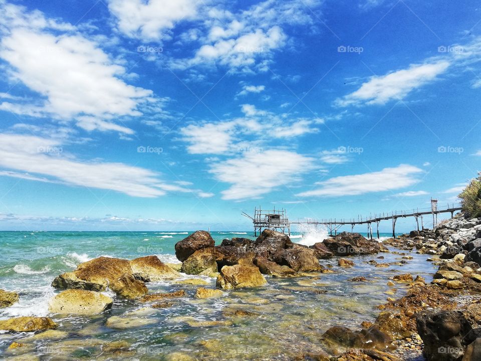 Overflow on the sea with some clouds on the horizon